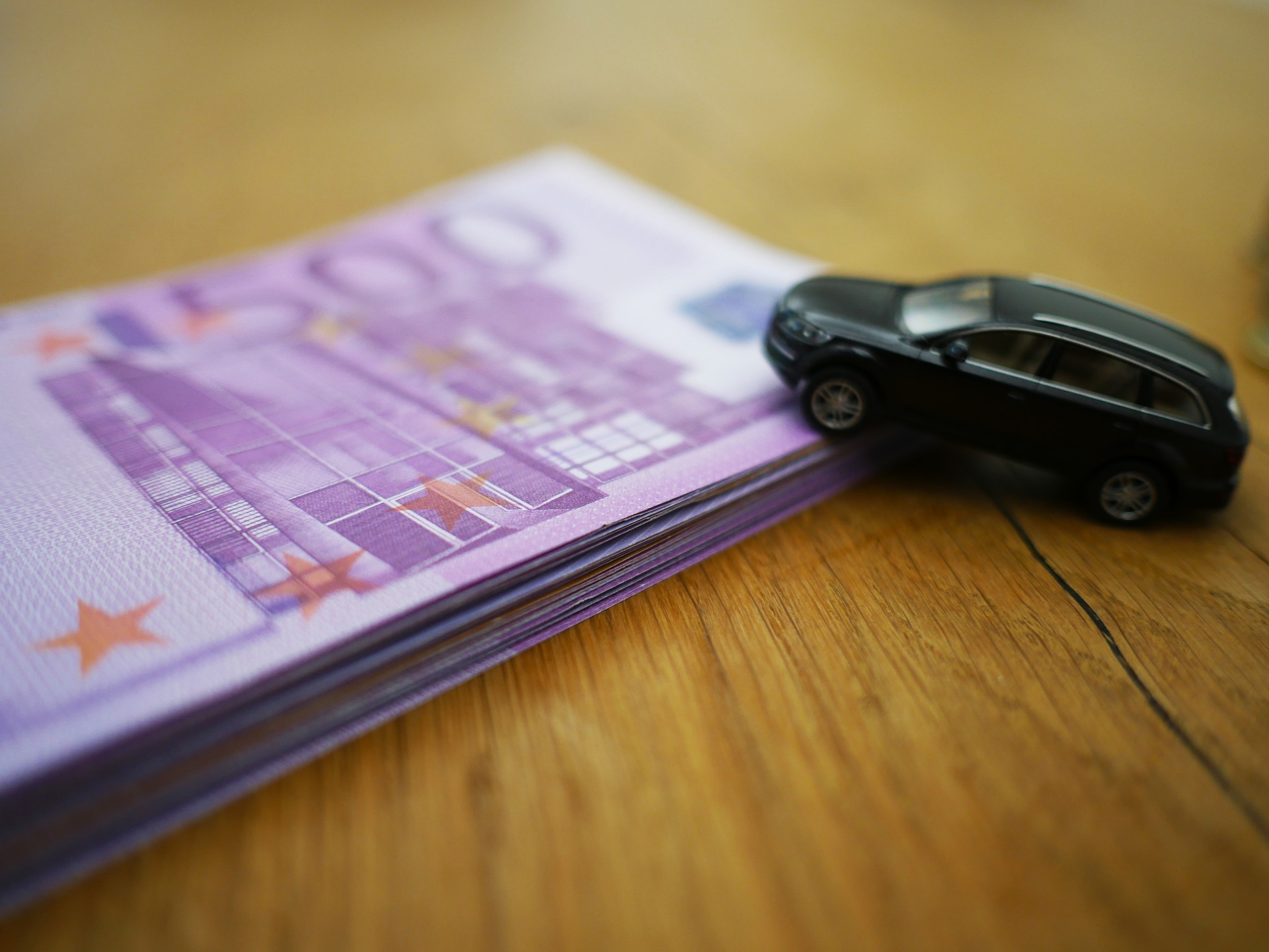 money and toy car